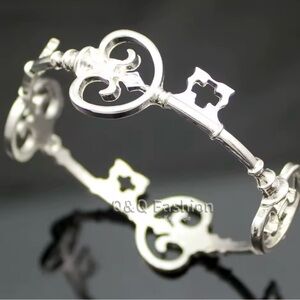 New. Polished Silver Skeleton Key Bangle bracelet